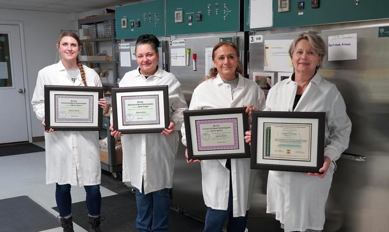 USDA Certificate and the Lab Team at Crookham Company holding Seed Technologist Certification